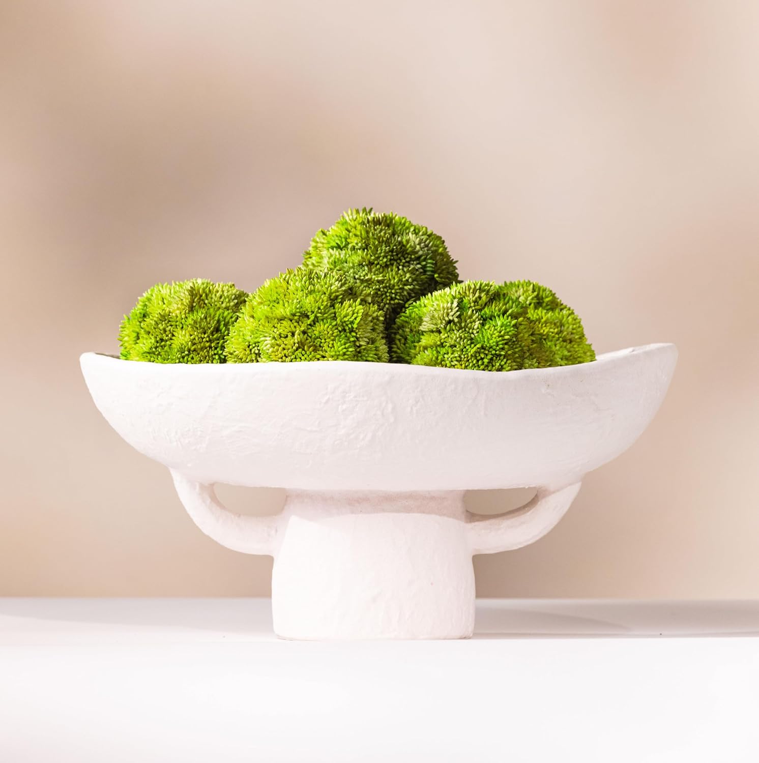 Laurel and Vine White Textured Ceramic Pedestal Bowl with Faux Moss Balls